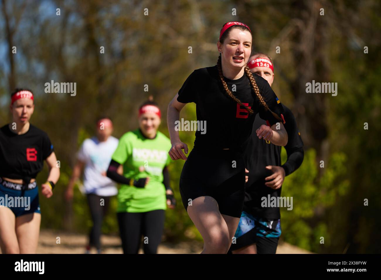 Group of Ukrainian athletes running at the Spartan Race competition in