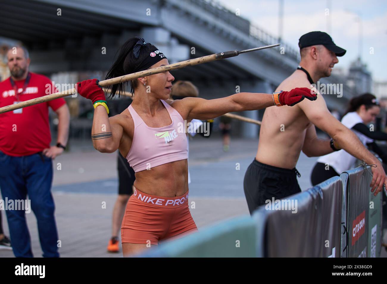 Strong Ukrainian woman throwing a spear at the Spartan Race competition