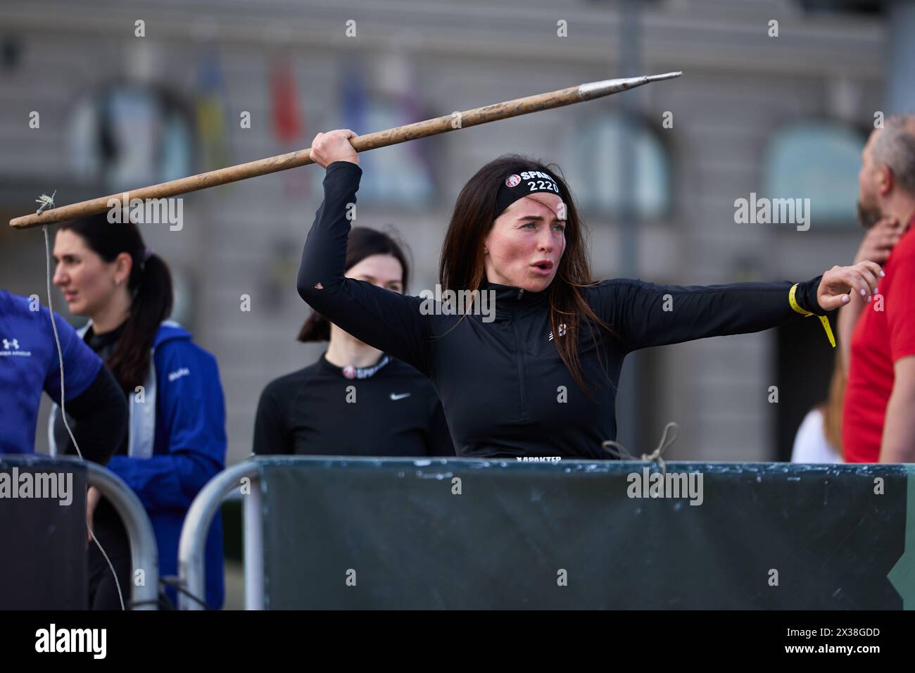 Ukrainian female throws a spear at the Spartan Race competition in Kyiv