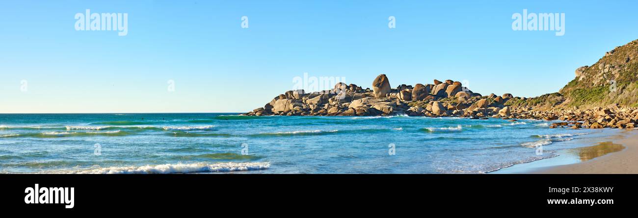 Oceanfront Rocks Ocean, rocks and banner on beach with landscape in nature in summer on ...