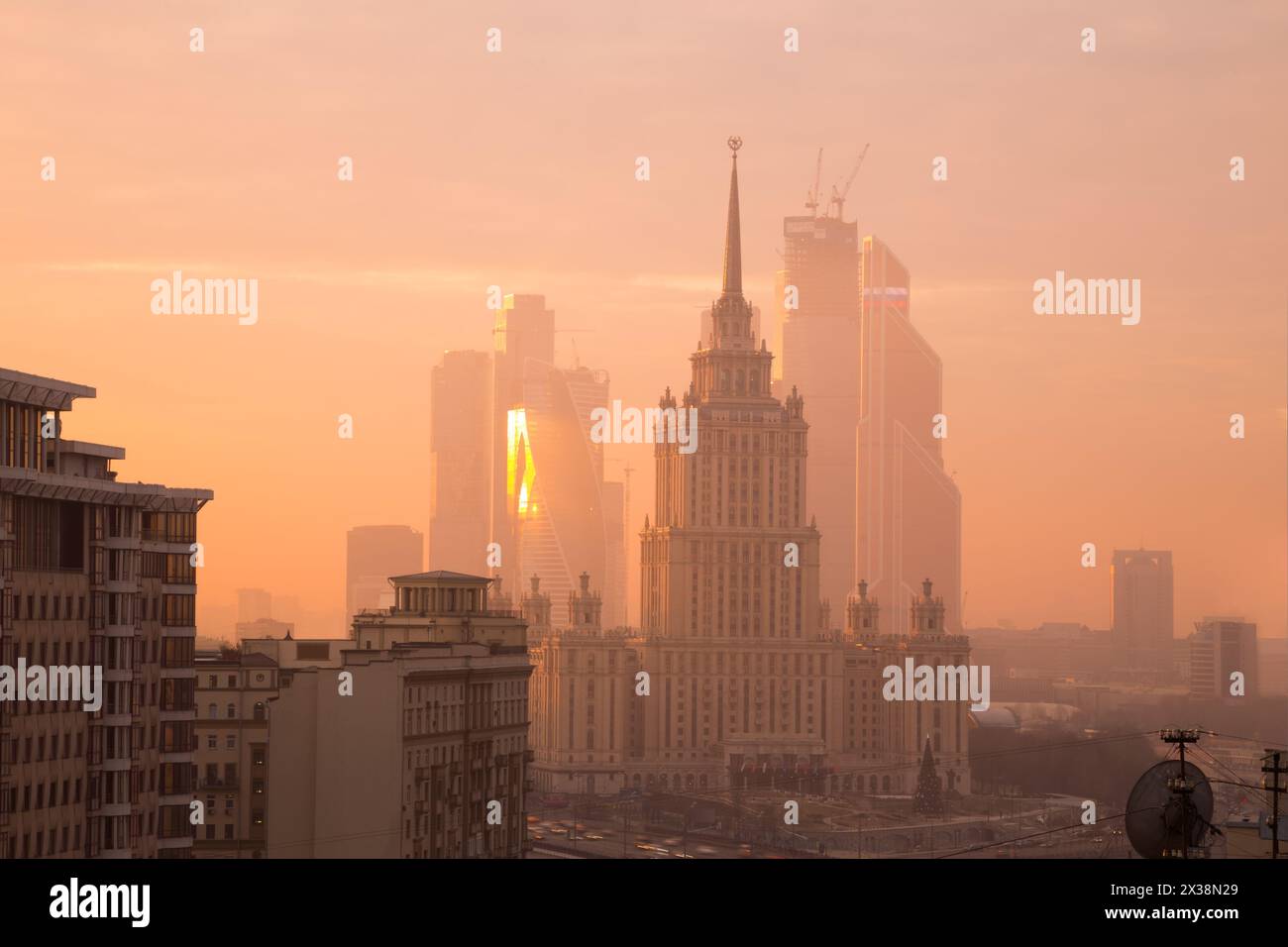 MOSCOW - NOV 29, 2014: Ukraine hotel (Stalin skyscraper) and Moscow International Business Center skyscrapers in fog at morning Stock Photo
