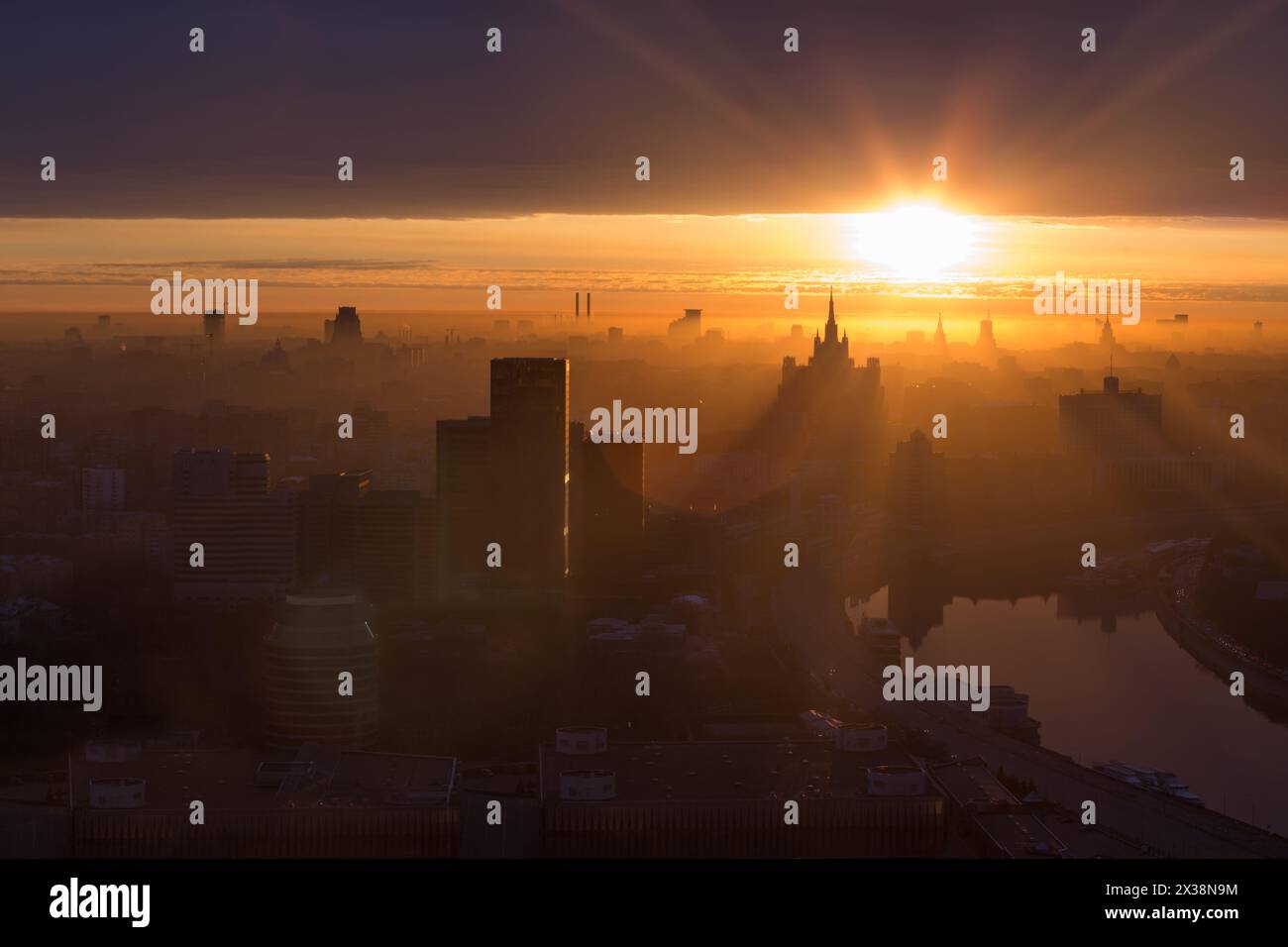 Silhouettes of buildings, Stalin skyscrapers and panorama of city during sunrise in Moscow, Russia Stock Photo