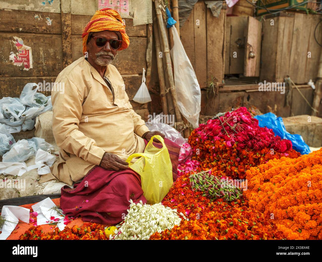 Elderly male flower seller in Varanasi, India Stock Photo