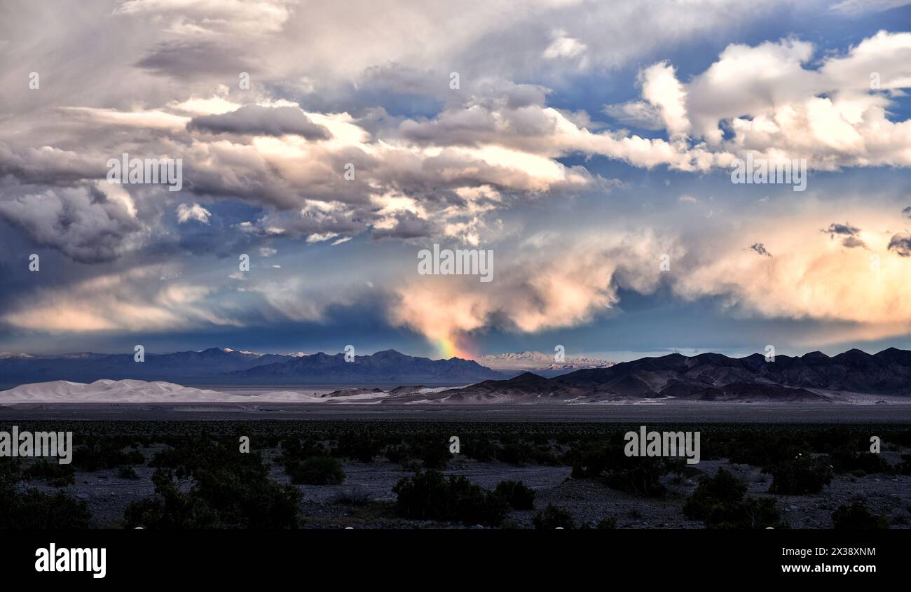 Rainbow over Dumont Dunes off Route 127, between Baker and Death Valley. Stock Photo