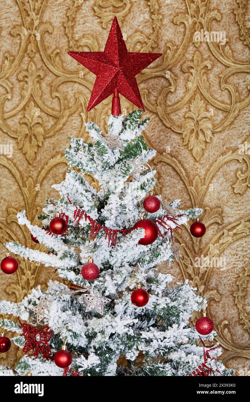 Top of christmas tree decorated with balls and star Stock Photo - Alamy