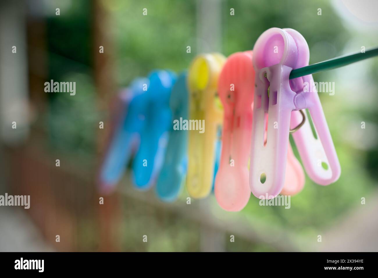 Old plastic cloth clip on the rope. Stock Photo