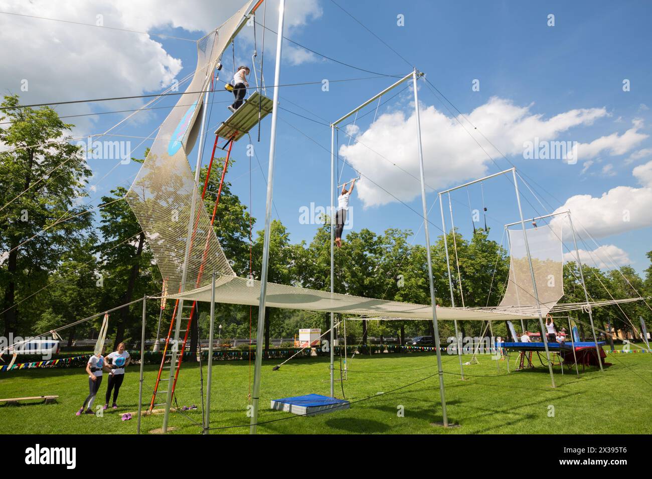 MOSCOW - MAY 26, 2016: Acrobats show on Trapeze. In Moscow, opened first in Russia trapeze for Air flight school and aerial gymnastics Trapeze Yota - Stock Photo