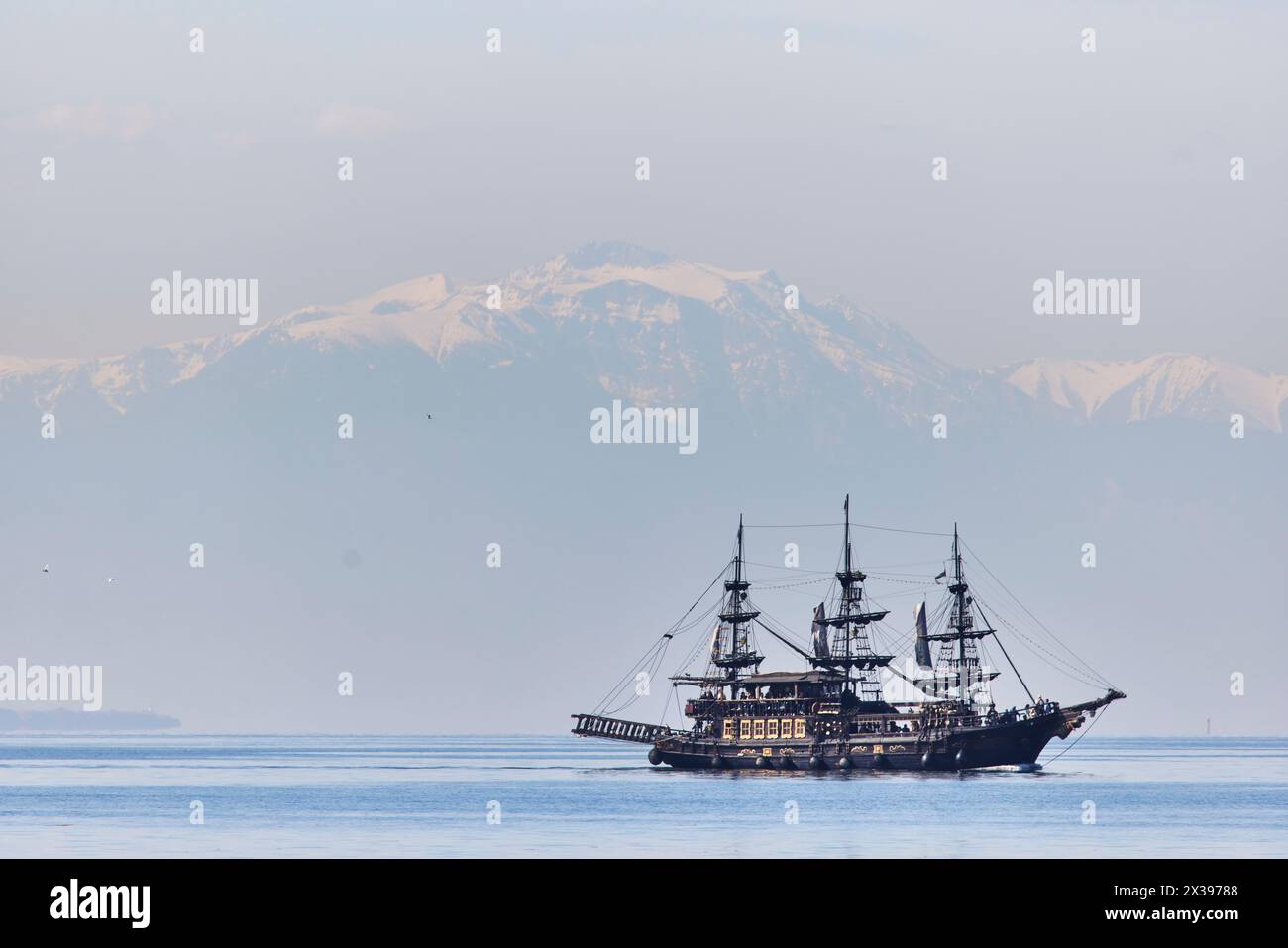Thessaloniki, greek city region of Macedonia in northern Greece pirate ship, tourist trips for free if drinking with Mount Olympus beyond Stock Photo