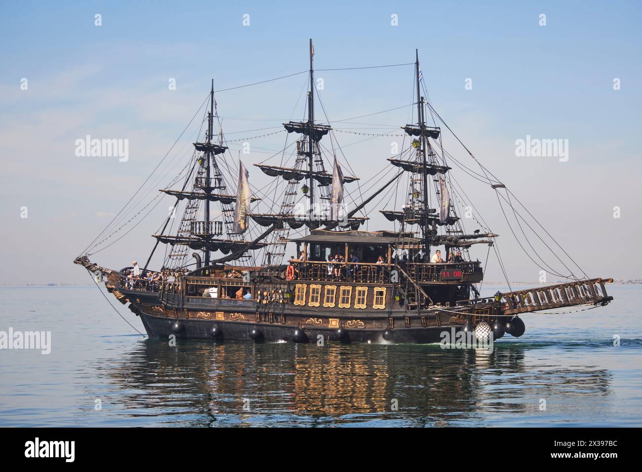 Thessaloniki, greek city region of Macedonia in northern Greece pirate ship, tourist trips for free if drinking with Mount Olympus beyond Stock Photo