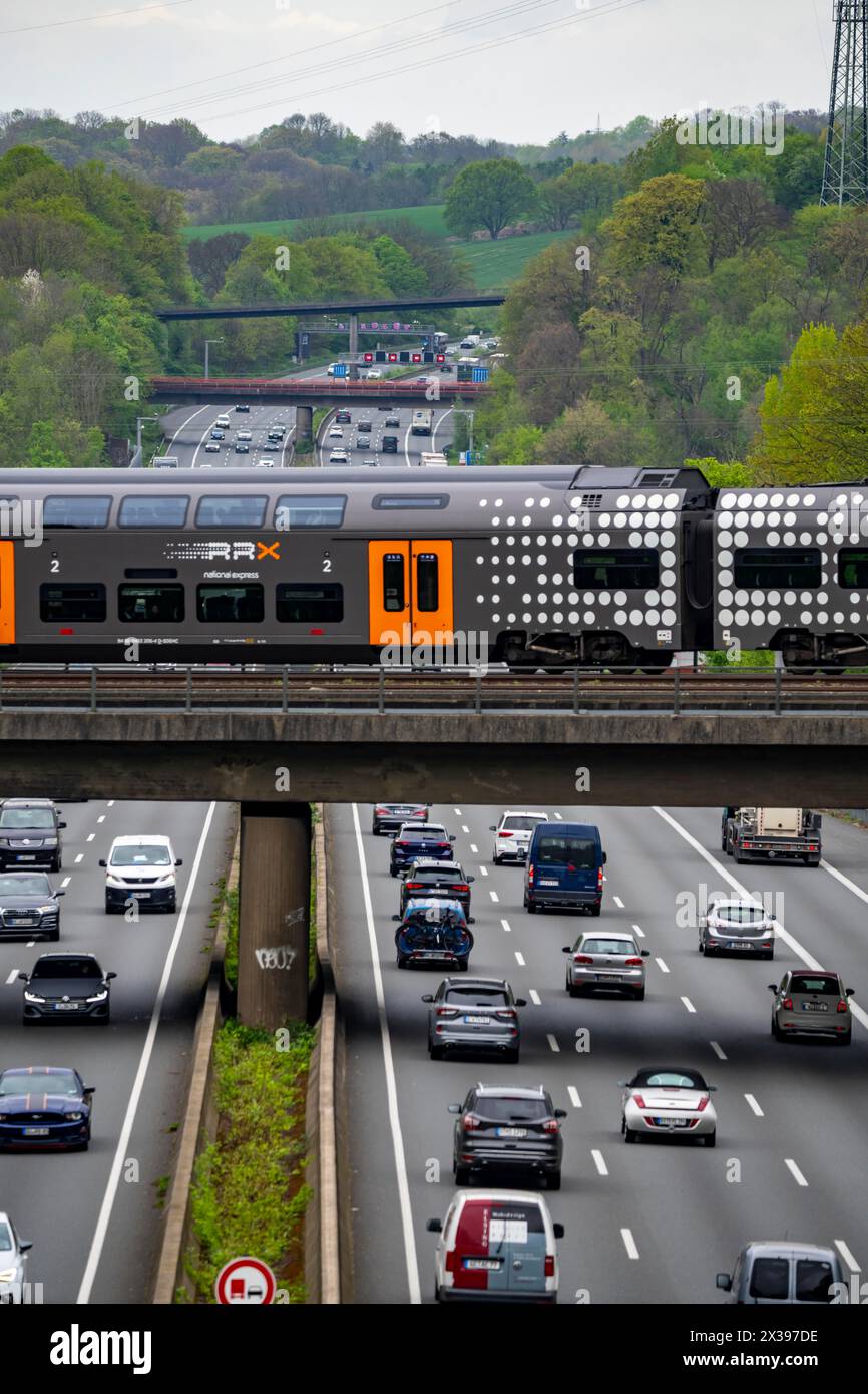 Rhein-Ruhr-Express, RRX train crosses the highway A3, traffic on 8 lanes, incl. the temporarily released hard shoulder, behind the highway junction Hi Stock Photo