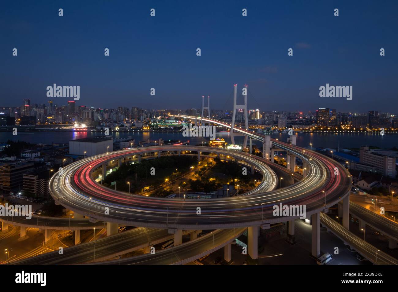 Huangpu Bridge and large transport interchange with illumination at dark night Stock Photo