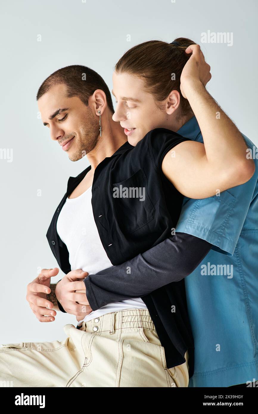 A tender moment between Two men as they hug each other. Stock Photo