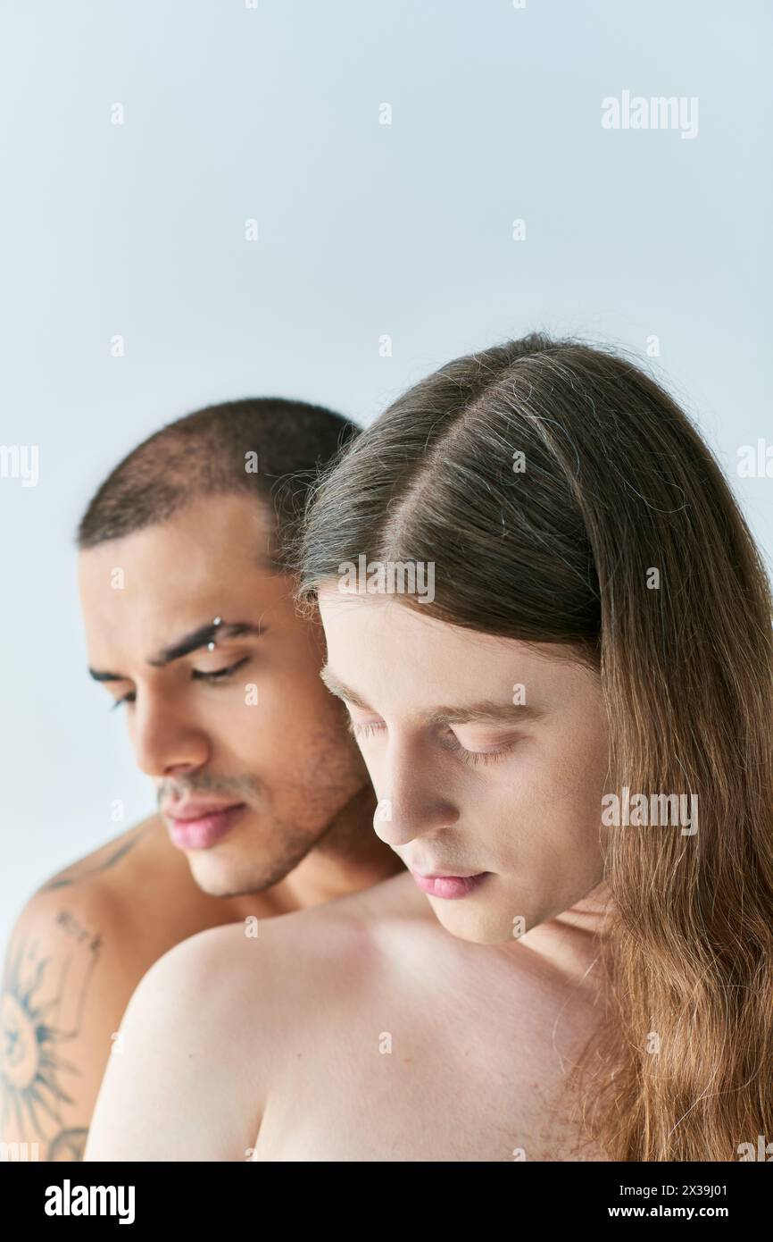 Two men sharing a moment while looking at a cell phone screen. Stock Photo