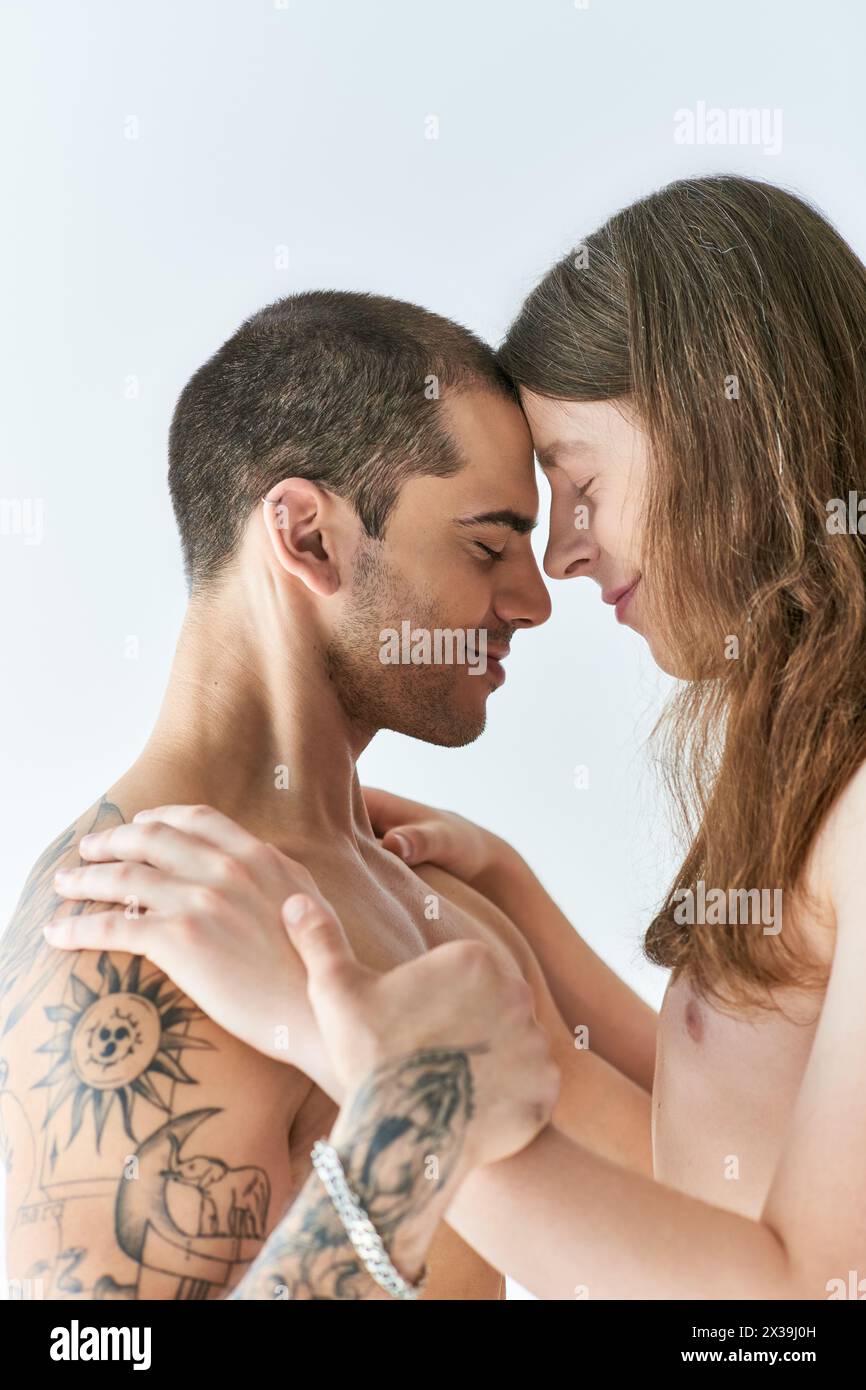 Two men share a tender embrace, expressing love and closeness. Stock Photo