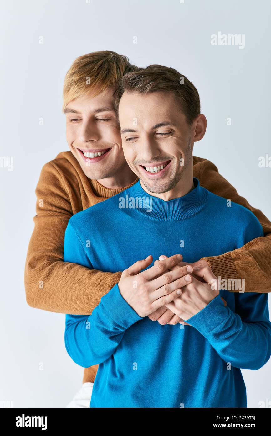 Two happy young handsome men hi-res stock photography and images - Alamy