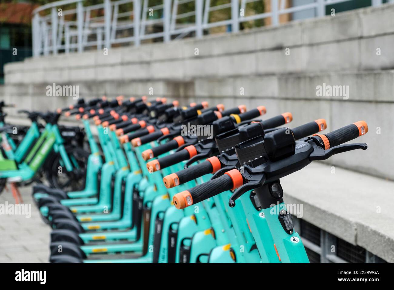 A row of Tier E-scooters Stock Photo