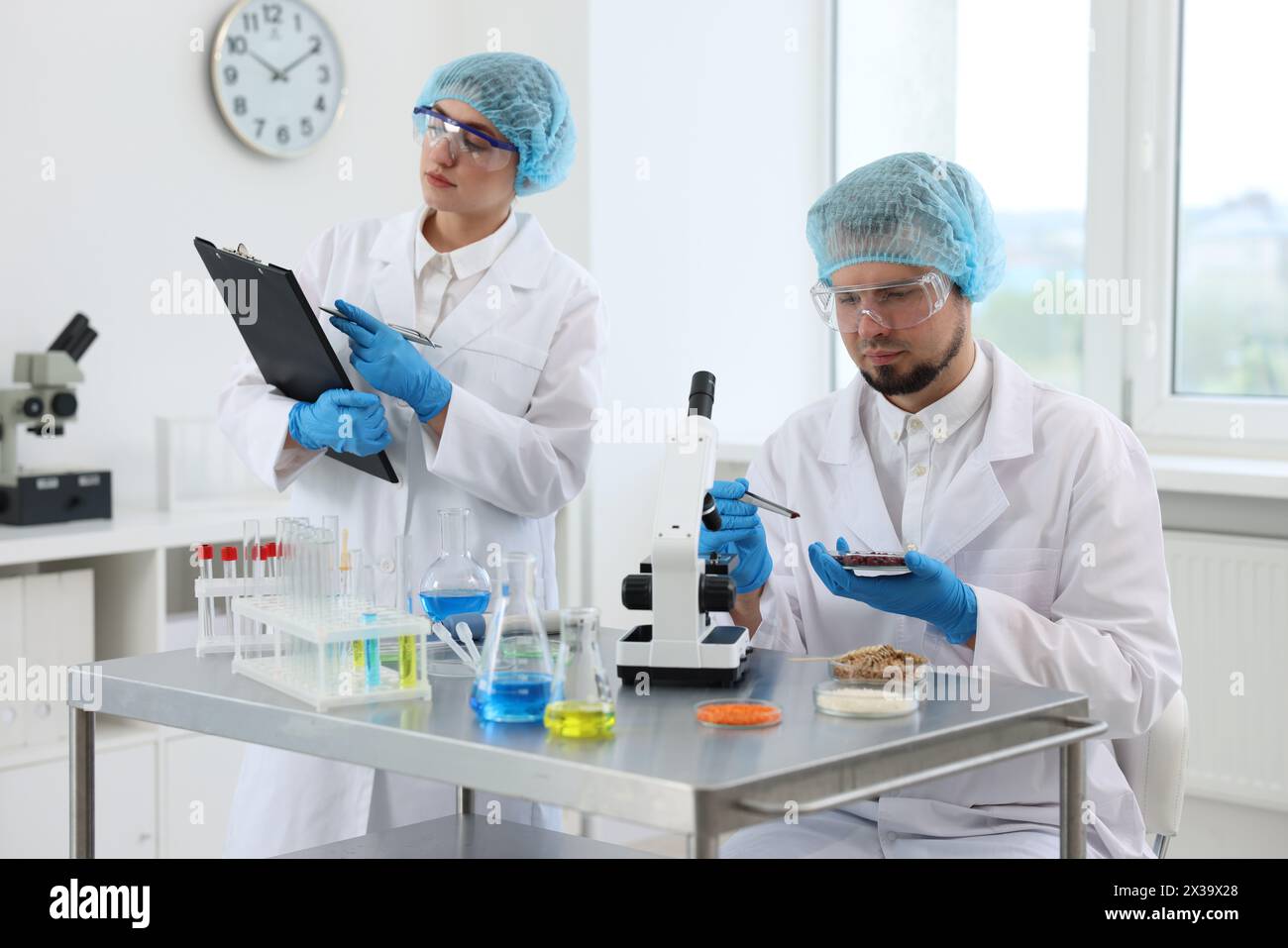 Quality control. Food inspectors checking safety of products in ...