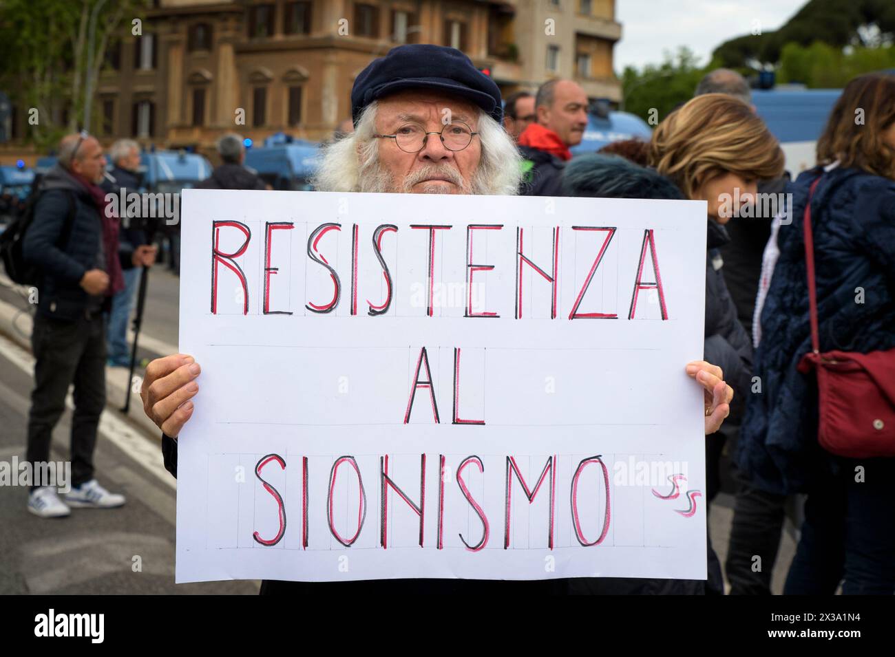 Rome, Italy. 25th Apr, 2024. A protester displays the sign reading 'resistance to Zionism' during the 'anti-fascist and anti-Zionist' rally, organized by pro-Palestinian movements, to protest against the presence of 'Zionist symbols' during the demonstrations of April 25th ( the day on which the liberation of Italy from Nazi occupation and fascism is commemorated) in Rome. (Credit Image: © Marcello Valeri/ZUMA Press Wire) EDITORIAL USAGE ONLY! Not for Commercial USAGE! Stock Photo
