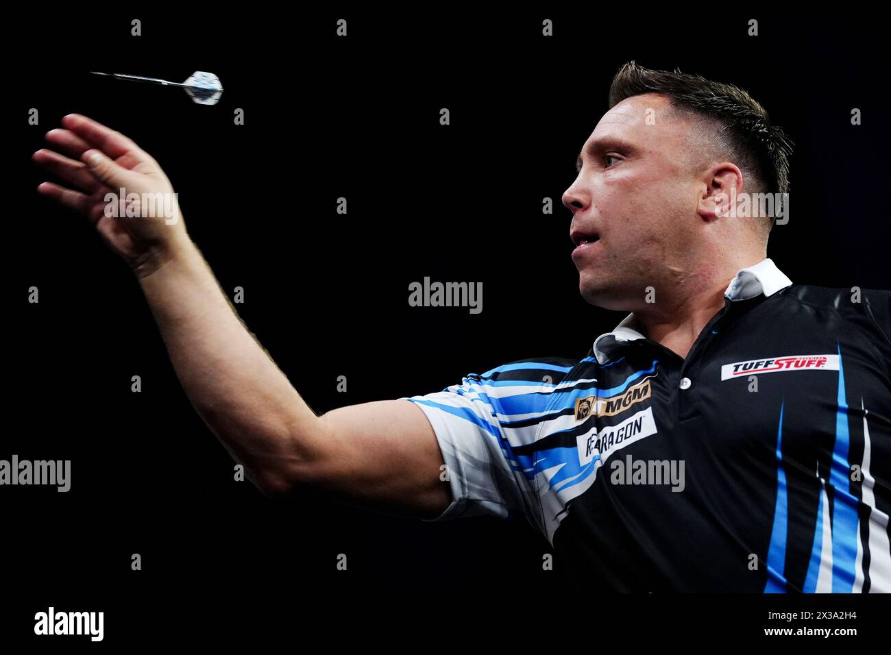 Gerwyn Price in action against Luke Littler (not pictured) on night thirteen of the 2024 BetMGM Premier League at the M&S Bank Arena, Liverpool. Picture date: Thursday April 25, 2024. Stock Photo