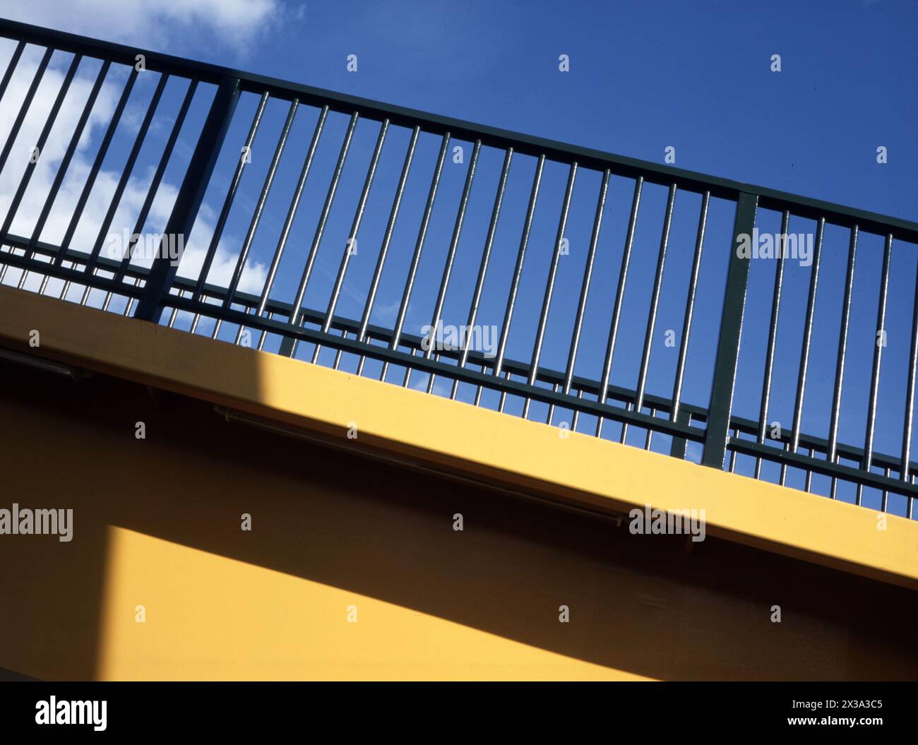 Detail of pedestrian footbridge over A48 at Coedkernew, framing LG building nearby, more recently sold to Microsoft. Stock Photo