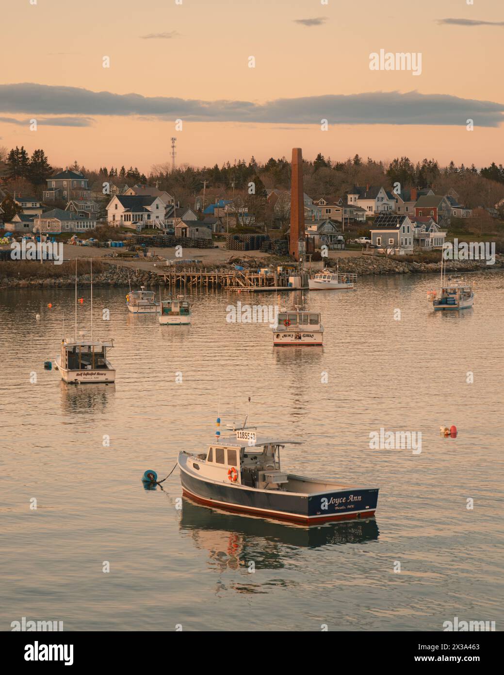 Sunset view of boats in the harbor in Jonesport, Maine Stock Photo