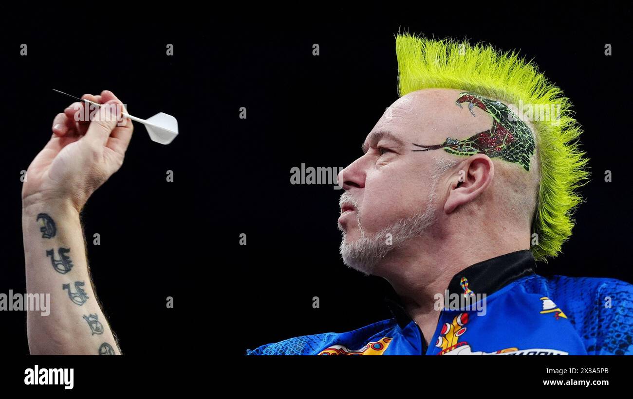 Peter Wright in action against Michael van Gerwen (not pictured) on night thirteen of the 2024 BetMGM Premier League at the M&S Bank Arena, Liverpool. Picture date: Thursday April 25, 2024. Stock Photo