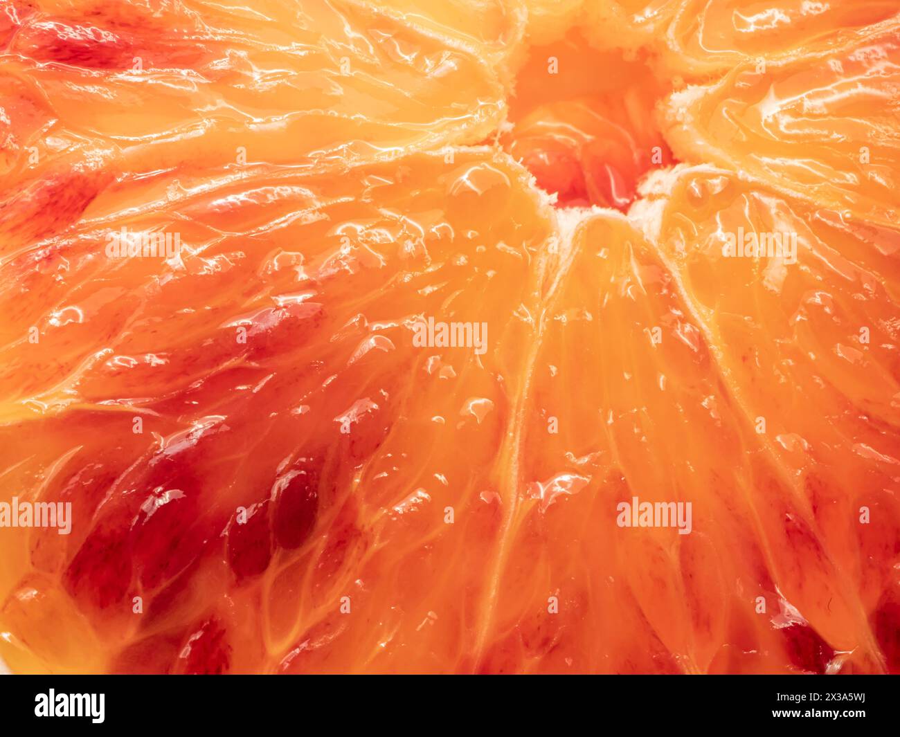 Juicy slice of Sicilian orange fruit. Macro Stock Photo - Alamy