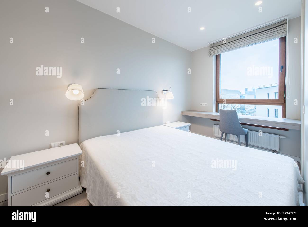 Minimalism Bedroom Interior. Window, Chair and Table in Background Stock Photo