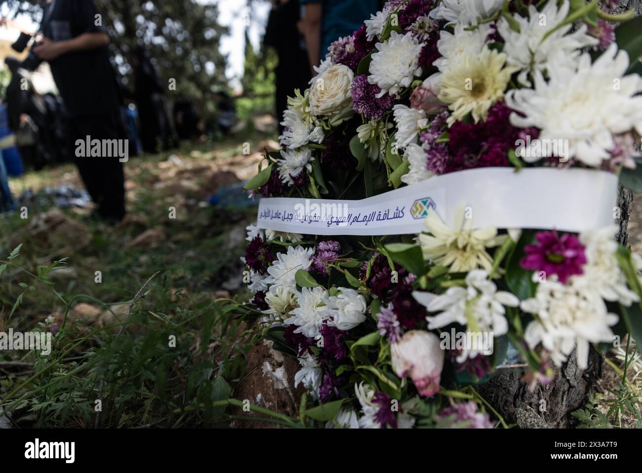 Hanin, Lebanon. 25th Apr, 2024. A wreath from Imam Mahdi Scouts is placed against a tree as Sarah Hussein Qashqash, 10, is buried at Hanin, Lebanon on April 25, 2024. She and her aunt were killed April 23 by an Israeli airstrike that targeted their family home. (Credit Image: © Daniel Carde/ZUMA Press Wire) EDITORIAL USAGE ONLY! Not for Commercial USAGE! Stock Photo