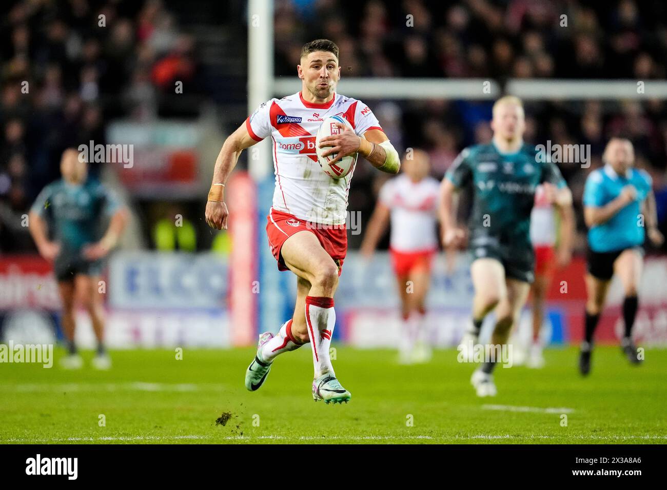 St Helens' Tommy Makinson scores their side's first try of the game ...