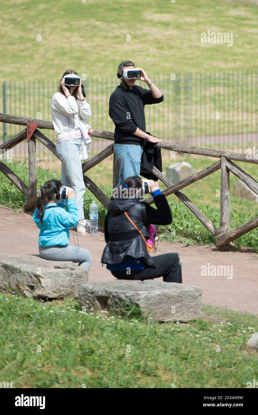 Rome, Italy. 25th Apr, 2024. Tourists with augmented reality viewers