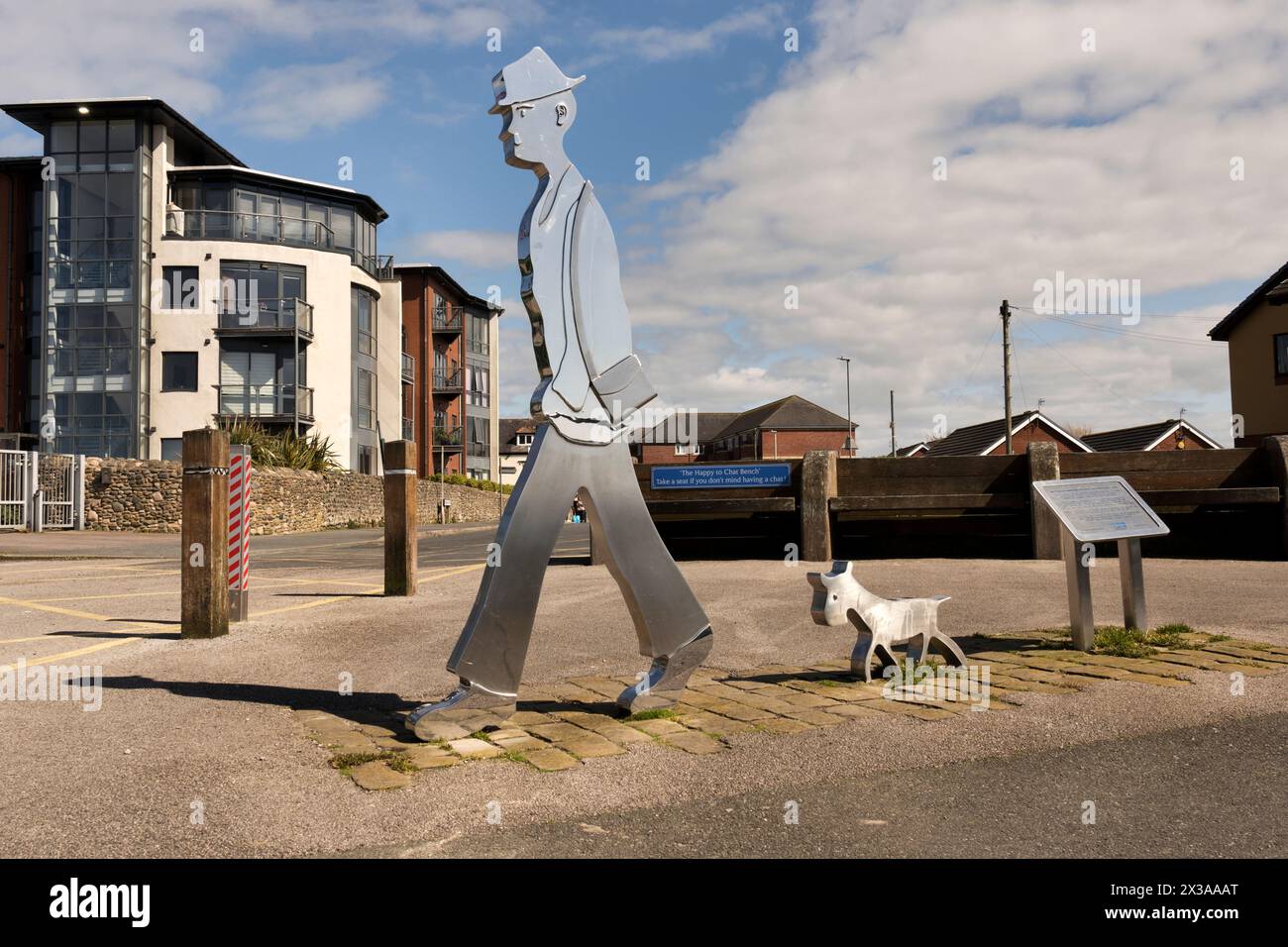 Stainless steel figures of a man and a dog, Knott End-on-Sea, Lancashire. An artwork created to commemorate the visits and work of painter L.S. Lowry. Stock Photo