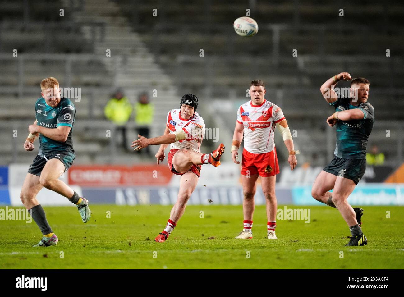 St Helens' Jonny Lomax (centre left) scores their side's third conversion of the game during the Betfred Super League match at the Totally Wicked Stadium, St Helens. Picture date: Thursday April 25, 2024. Stock Photo