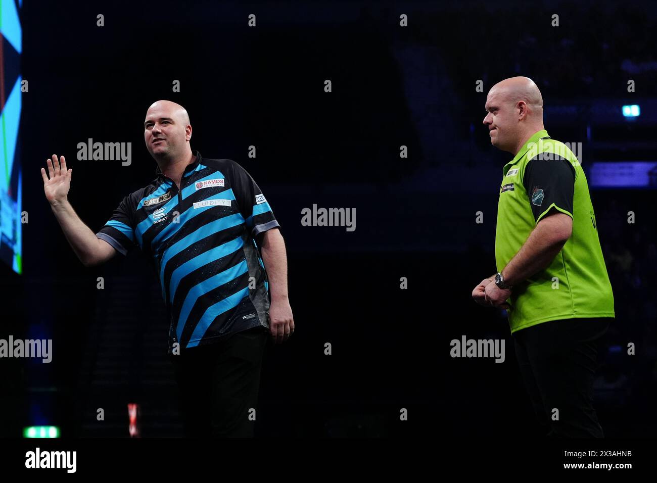 Rob Cross (left) and Michael van Gerwen during their semi-final match on night thirteen of the 2024 BetMGM Premier League at the M&S Bank Arena, Liverpool. Picture date: Thursday April 25, 2024. Stock Photo