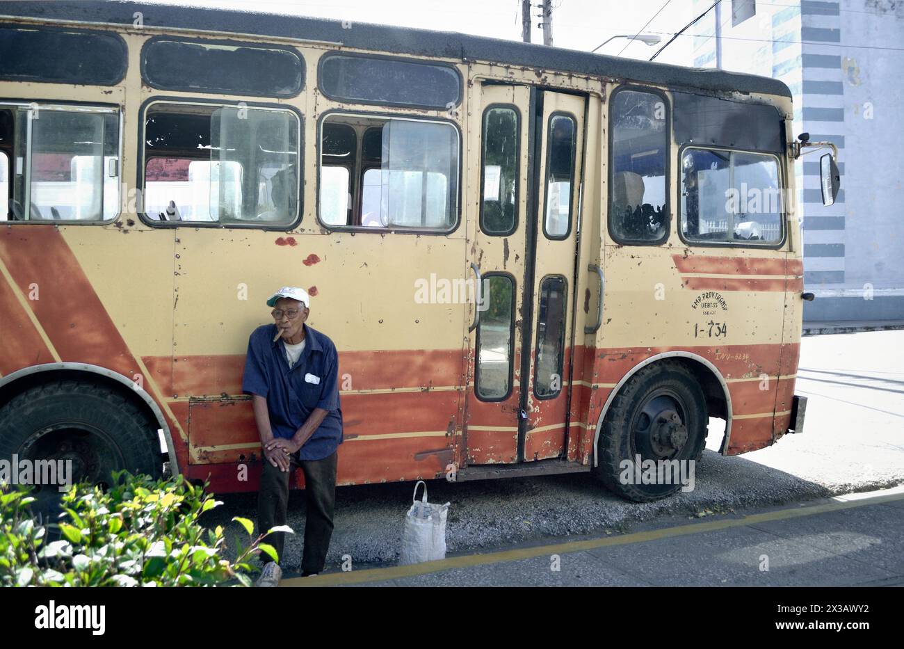 Local bus and driver in centre of Sanctus Spiritus, Cuba. Stock Photo