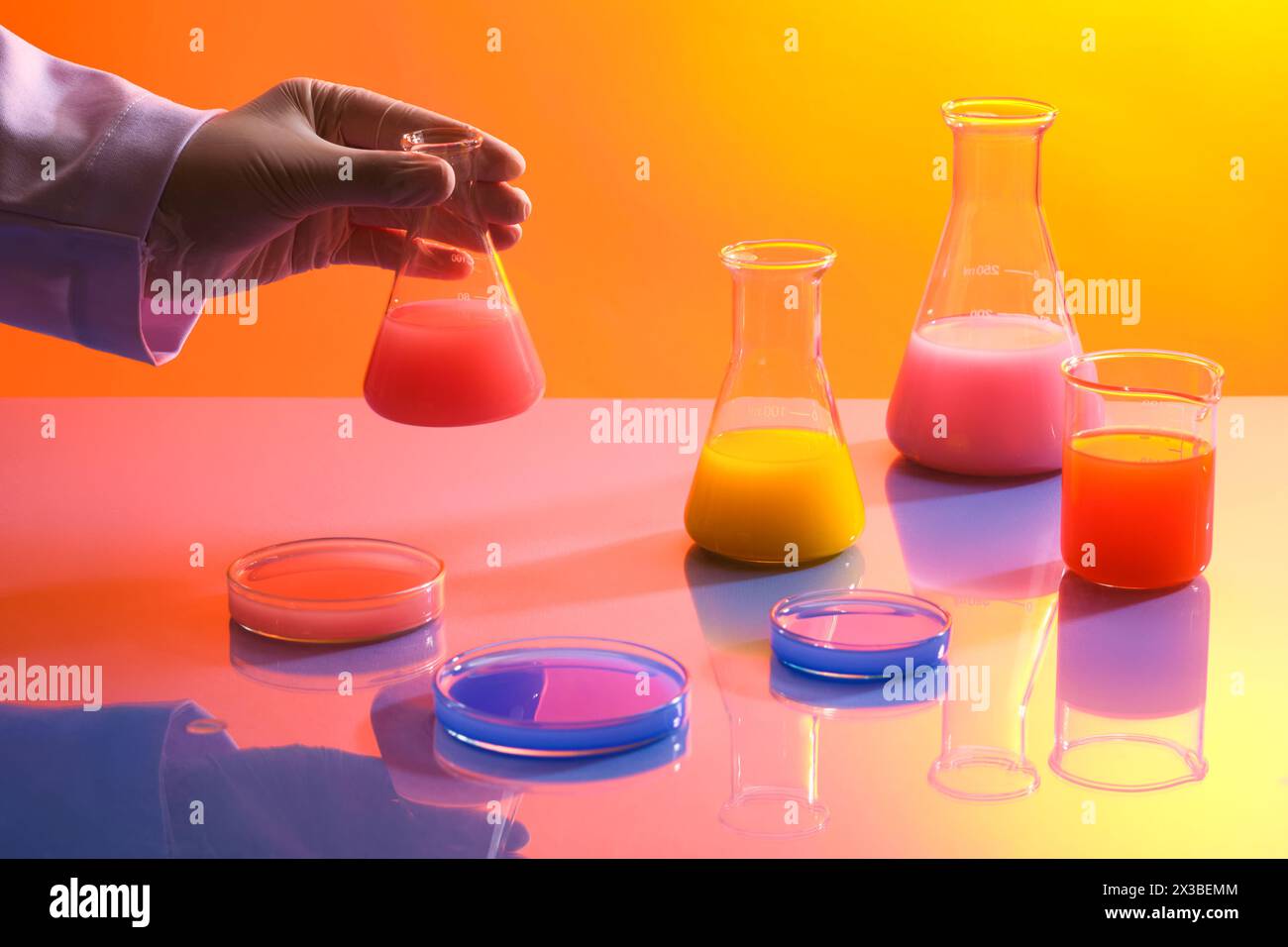 Colorful chemical liquid are divided into several different laboratory ...