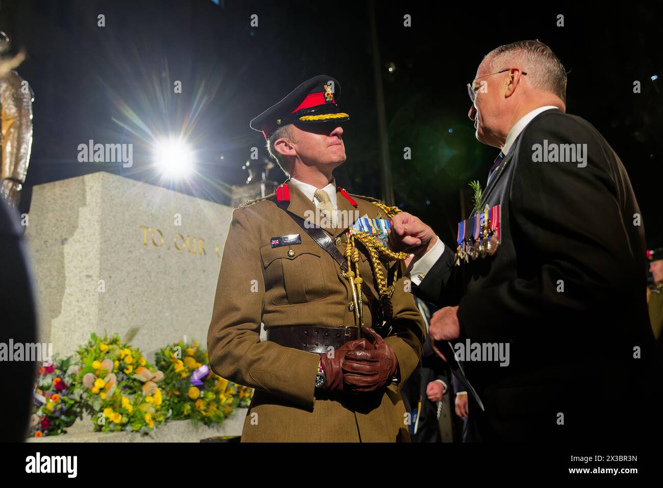 Sydney, Australia. 25th Apr, 2024. Brigadier Nigel Best talks with a guest after the ANZAC Day Dawn Service at the Martin Place Cenotaph on April 25, 2024 in Sydney, Australia Credit: IOIO IMAGES/Alamy Live News Stock Photo