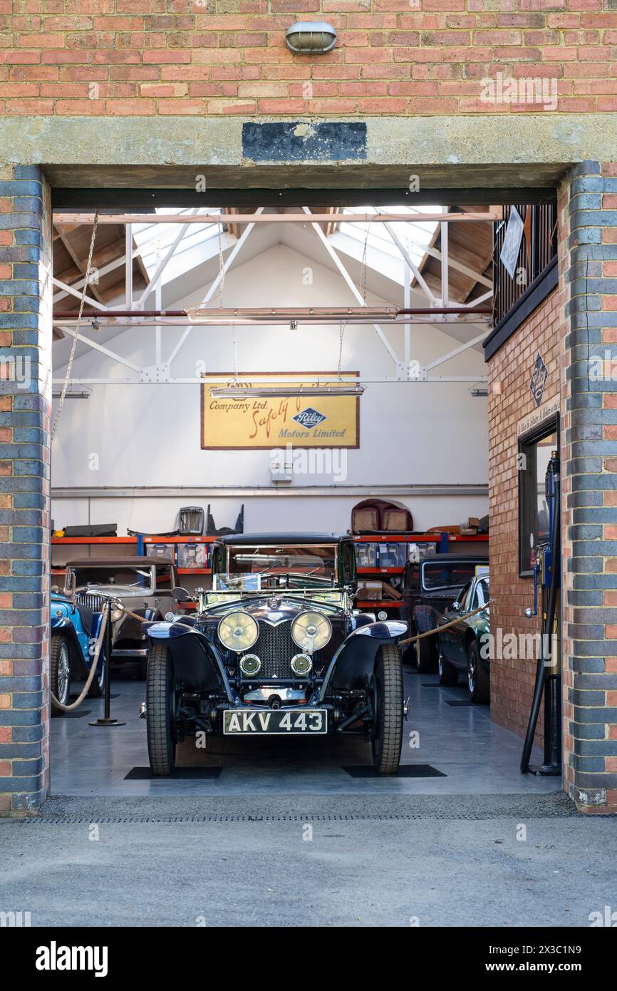 1935 Riley in a workshop at Bicester Heritage Centre, sunday scramble event. Bicester, Oxfordshire, England Stock Photo