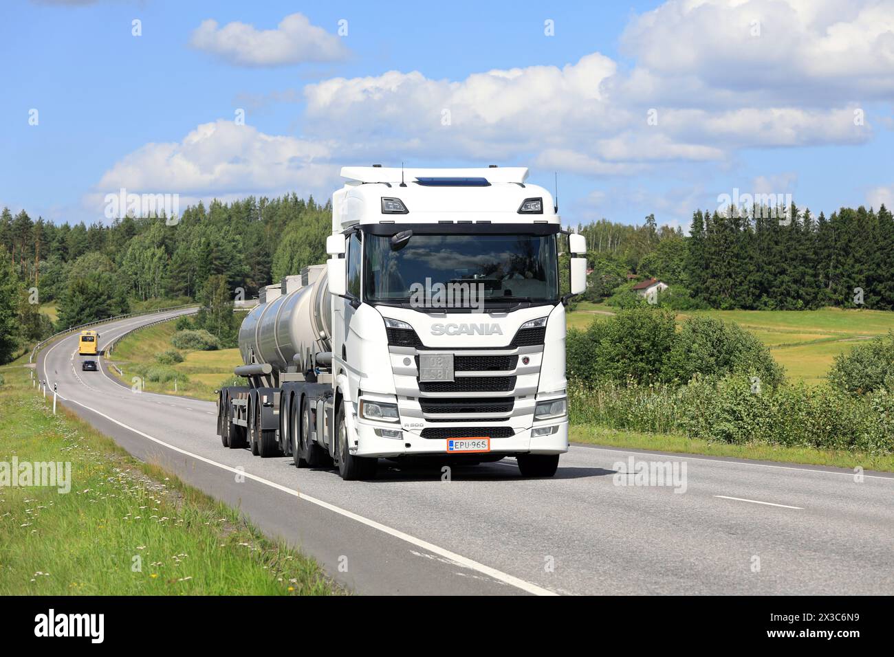 White Scania R500 truck tank trailer transports load along highway on a sunny day of summer. Copy space. Salo, Finland. August 9, 2023. Stock Photo