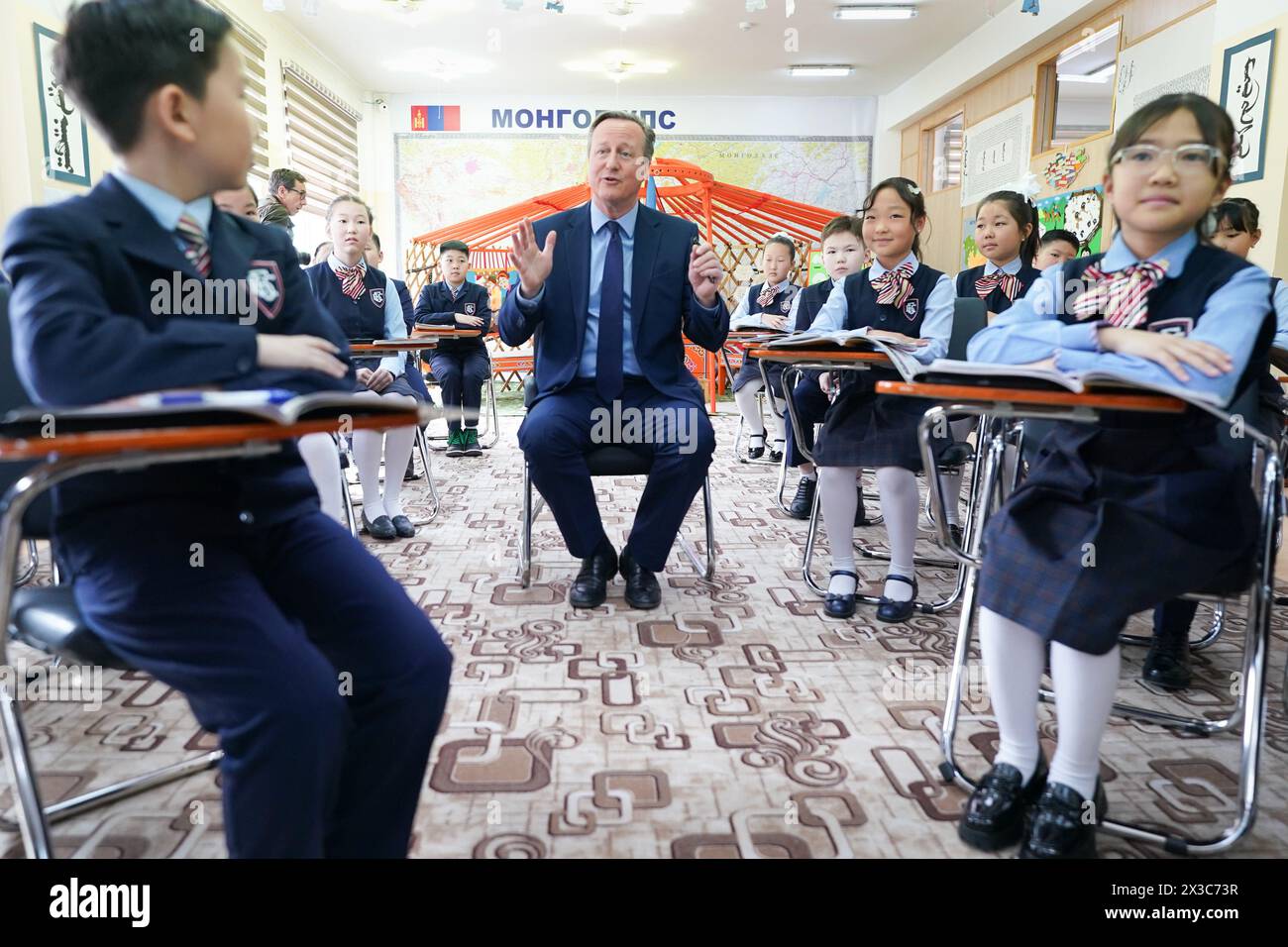 Foreign Secretary Lord David Cameron meets pupils and takes part in an English lesson at School No.23 in Ulaanbaatar, Mongolia, on the fifth day of his five day tour of the Central Asia region. Picture date: Friday April 26, 2024. Stock Photo