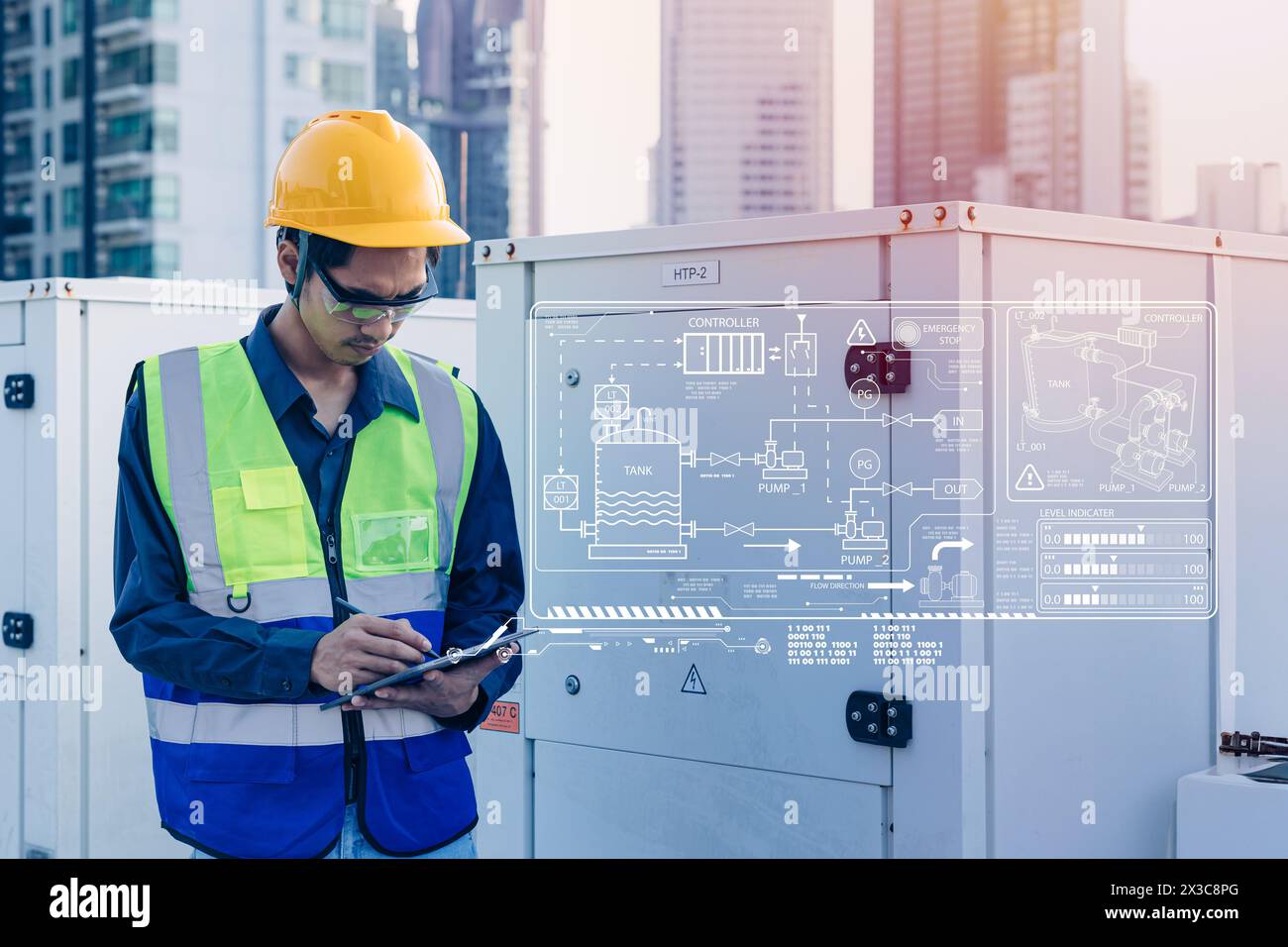 engineer using modern technology device software checking water pump tank pipe workflow heating system. worker looking tablet overlay pipes layout. Stock Photo