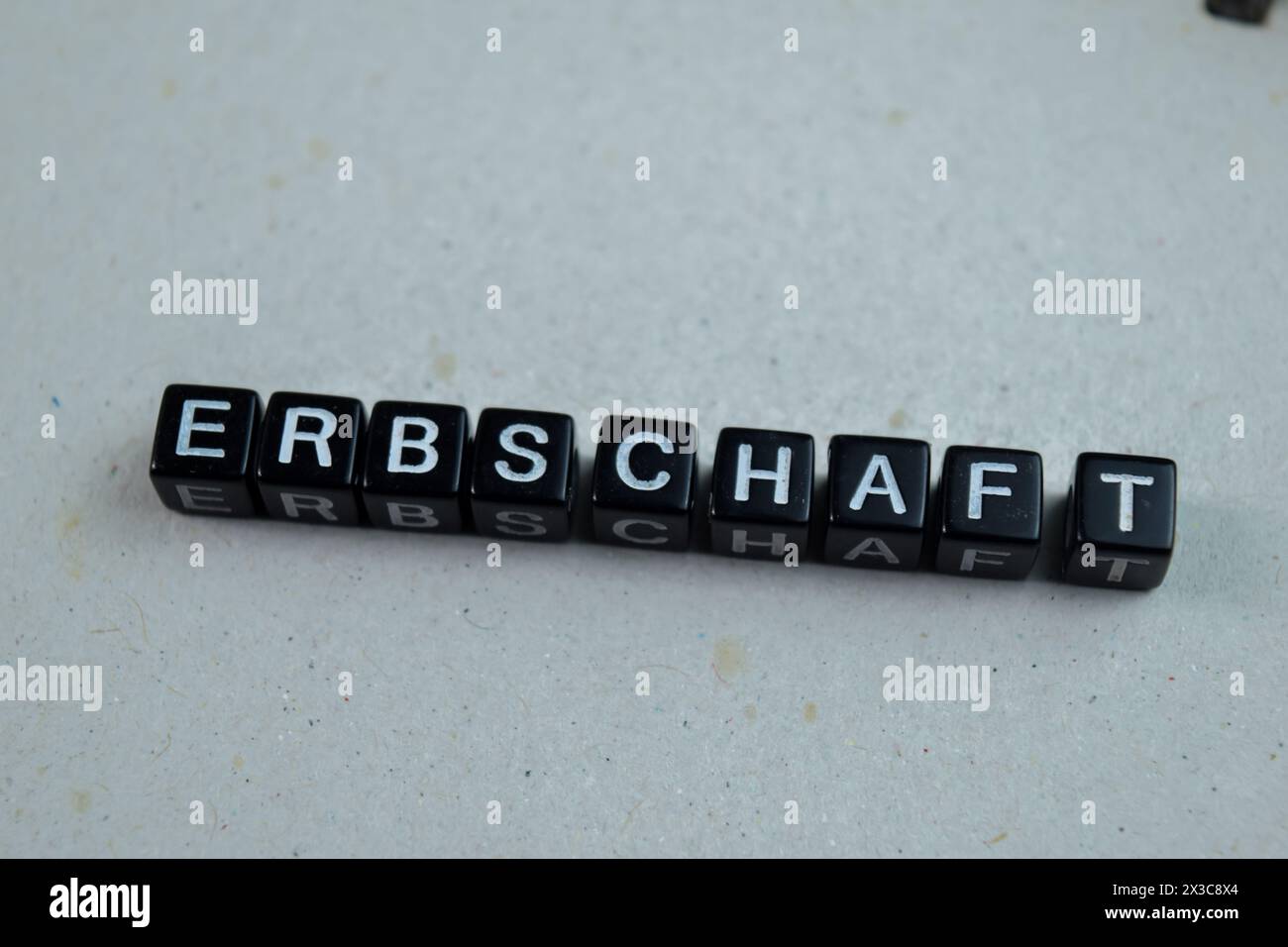 Concept of Erbschaft written on wooden blocks. Cross processed image on Wooden Background Stock Photo