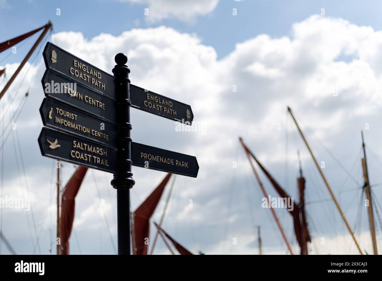 MALDON, ESSEX, UK - APRIL 25, 2024:  Signpost on Hythe Quay with directions to Coastpath Town Centre and Saltmarsh Coast Trail Stock Photo