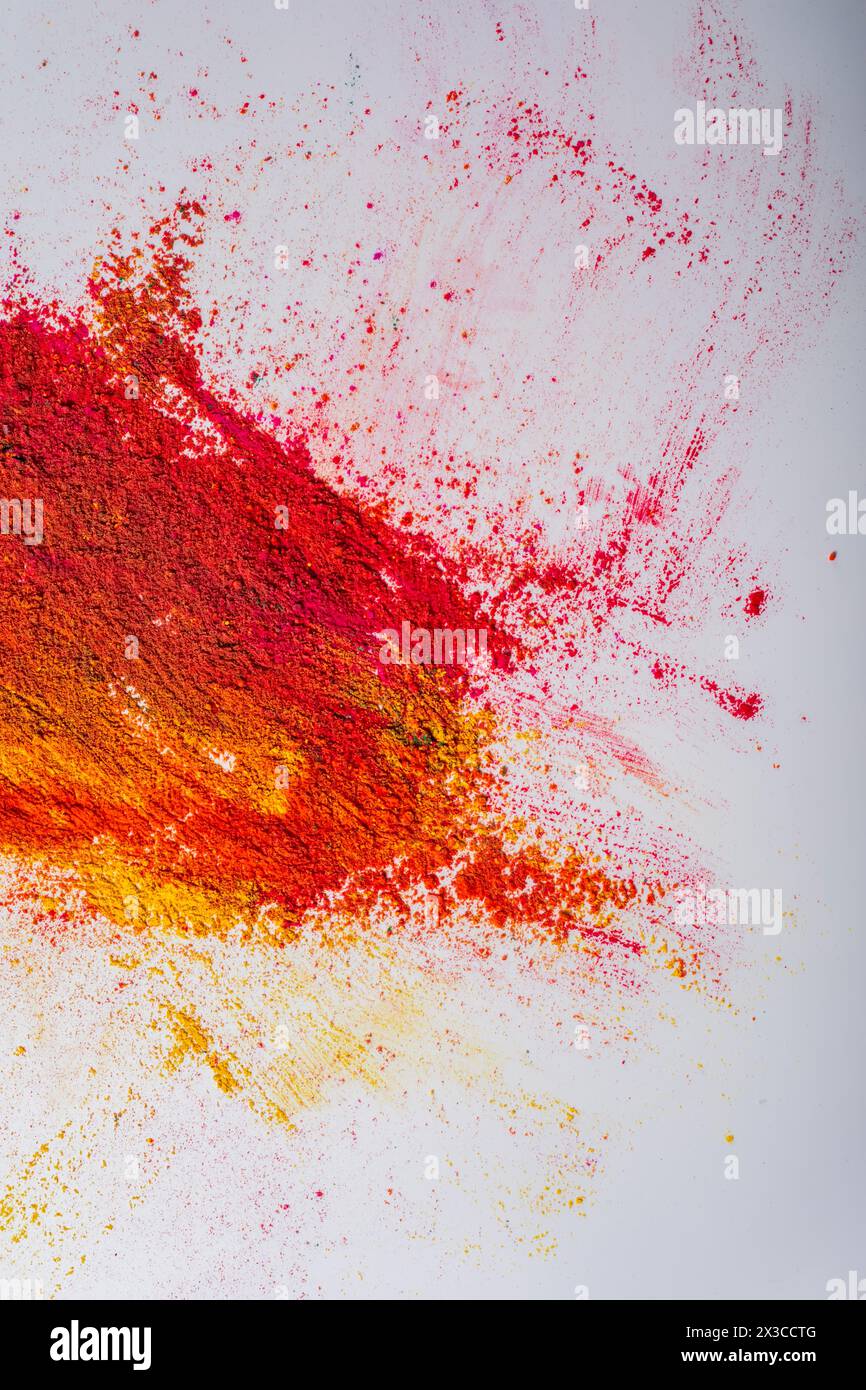 Holly Powder Exploding Colorful holi powder explosion on white background. Colorful powder ...