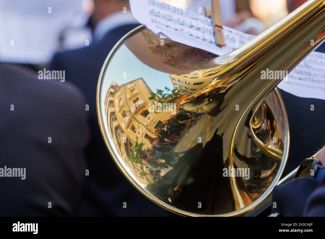 Reflections in the trombone bell of the adjacent buildings during the Alcoy festivities, Spain Stock Photo