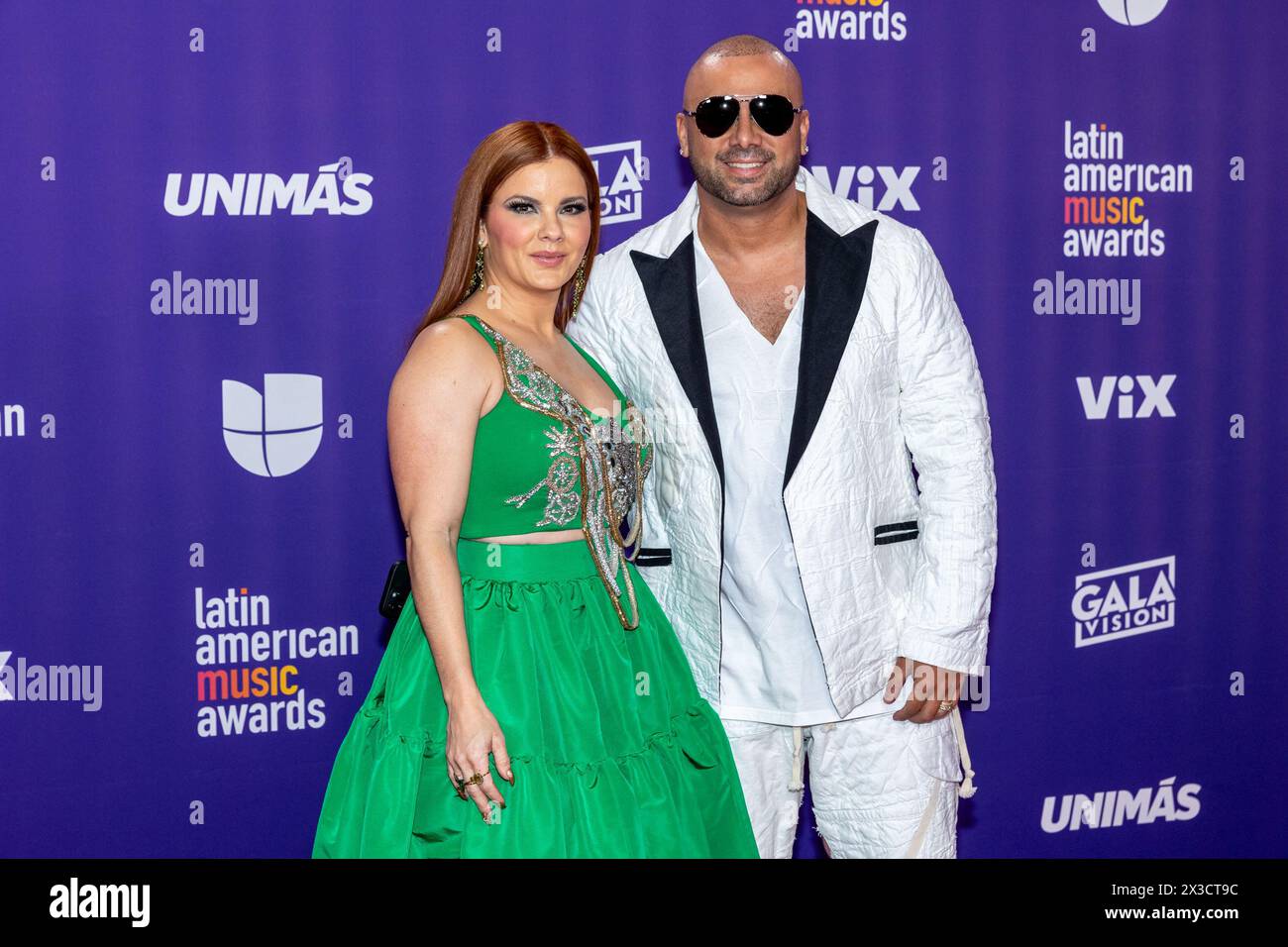 Las Vegas, USA. 25th Apr, 2024. Yomaira Ortiz Feliciano (L) and Wisin attend the 2024 Latin American Music Awards (Latin AMAs) at the MGM Grand Garden Arena in Las Vegas, Nevada on April 25, 2024. (Photo by Travis P Ball/Sipa USA) Credit: Sipa USA/Alamy Live News Stock Photo
