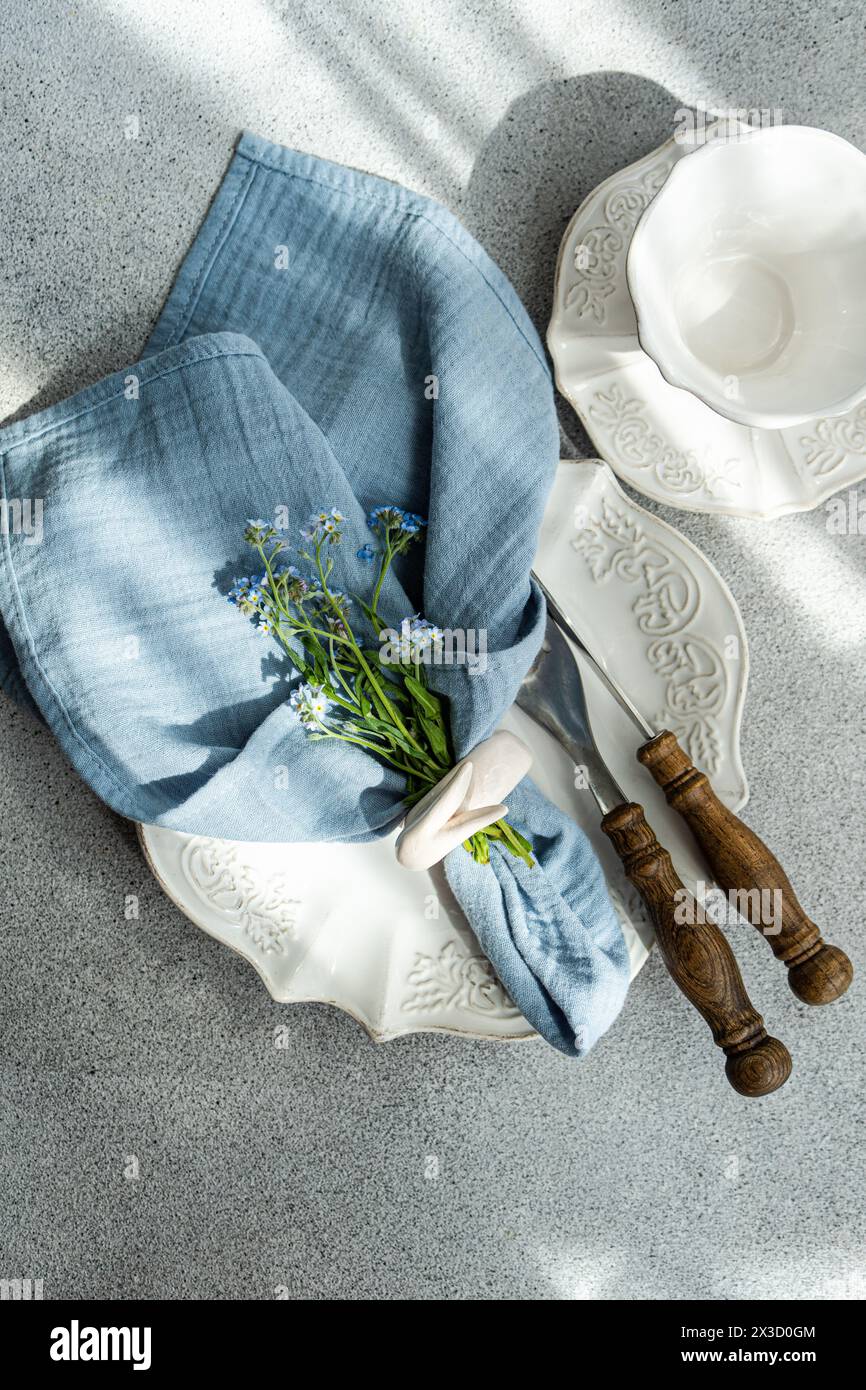 Spring table setting with flowers Stock Photo