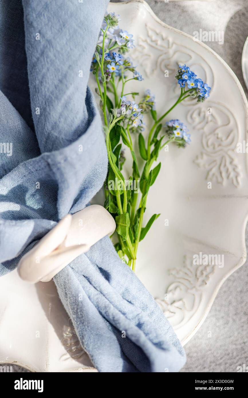 Spring table setting with flowers Stock Photo