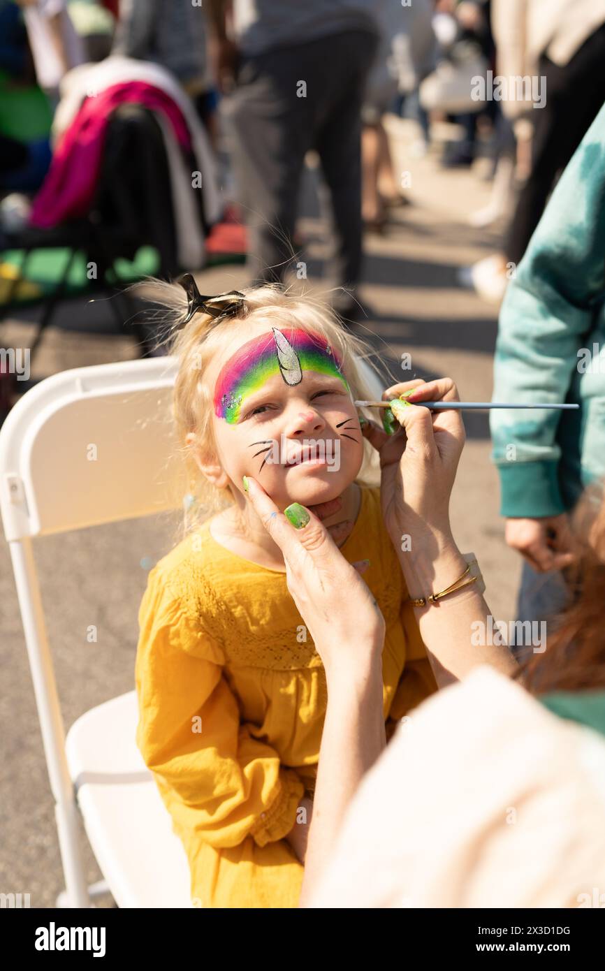 Rainbow Unicorn Girl Gets Face Paint At St. Patricks Day Festival Stock Photo