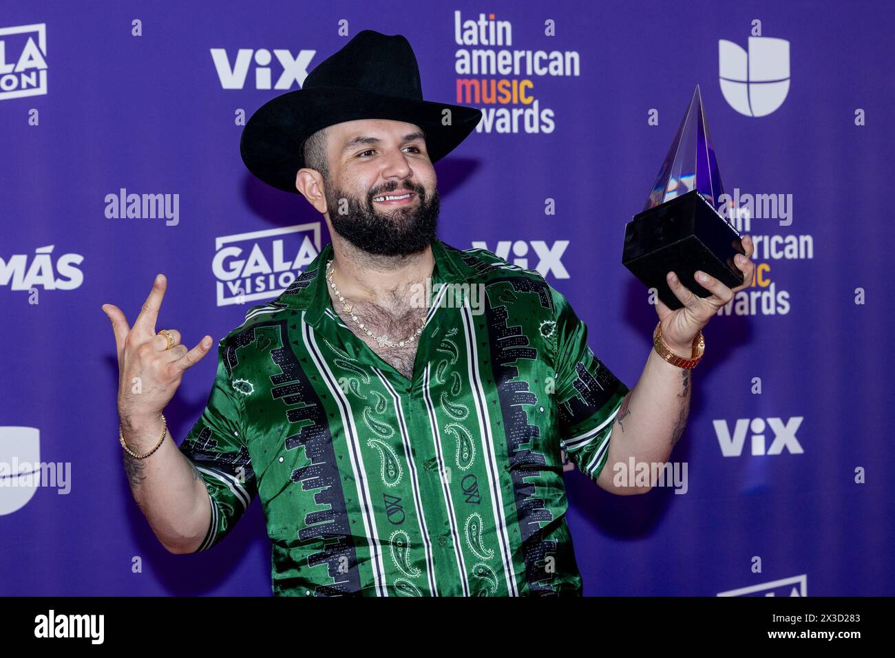 Las Vegas, USA. 25th Apr, 2024. Carin Leon shows off his award at the